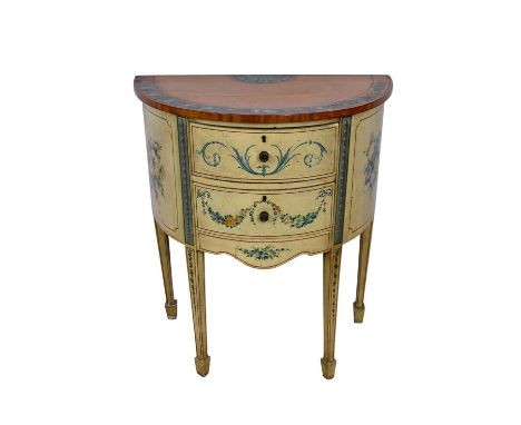 Regency style polychrome painted and satinwood demi-lune commode, with two frieze drawers on square tapered legs and spade fe