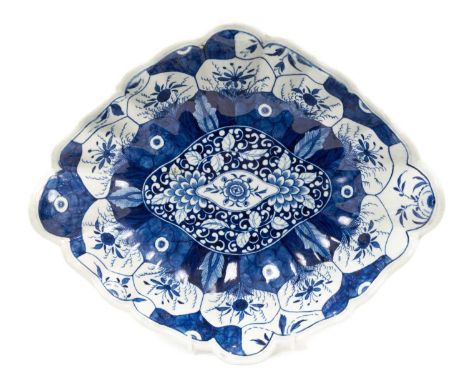 Unusual Worcester centre dish, circa 1770, painted in blue with the Kangxi Lotus pattern, pseudo-Chinese mark to base, 31cm w
