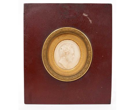 Early 19th century wax portrait medallion of Sir Robert Peel by John J de Veaux, the oval medallion within titled ormolu moun