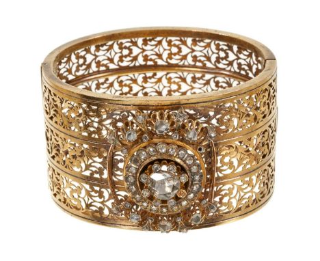 19th century gold and diamond hinged cuff bangle, the wide pierced band with an applied cluster of rose cut diamonds. Austria