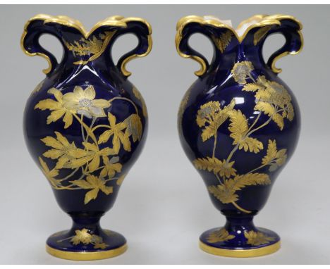 A pair of Spode blue ground baluster vases, gilt decorated with flowering shrubs 7in.