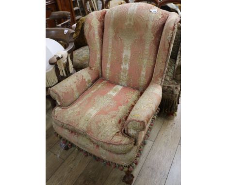 A Chippendale style mahogany wing armchair