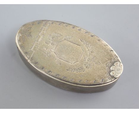 A George III silver oval snuff box by Phipps & Robinson, with engraved decoration and flowerhead thumbpiece, the interior lid