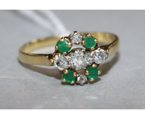 An 18ct gold, emerald and diamond cluster ring, size Q.