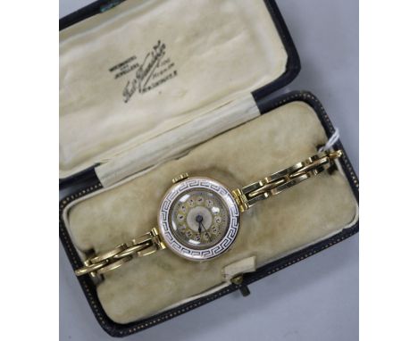 A lady's early 20th century 9ct gold and enamel manual wind wrist watch.