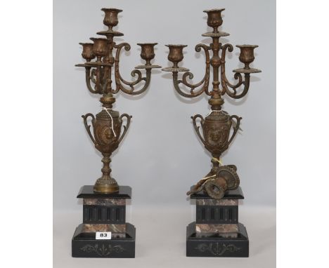 A pair of Victorian spelter and marble four-light candelabra, possibly part of a clock garniture (one a.f), H.51cm