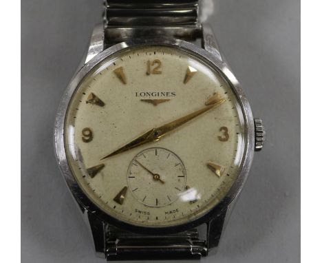 A gentleman's 1950's? stainless steel Longines manual wind wrist watch, with Arabic and arrowhead numerals and subsidiary sec