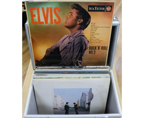 An aluminium record box containing 15 records, all originals by The Beatles, Pink Floyd, The Who, Elvis Presley etc., all VG-