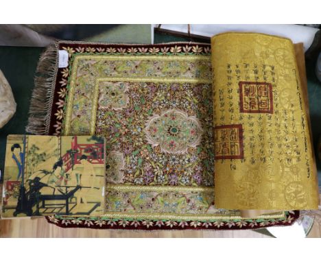 An Islamic scroll, a Chinese brocade panel, an embroidered and mounted panel and a book