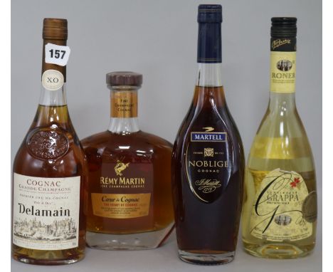 A bottle of Delamain XO "Rare & Dry", two cognacs and one grappa