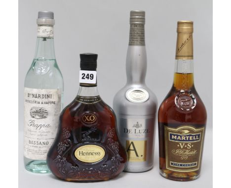 A bottle of Hennessy XO, two cognacs and one grappa
