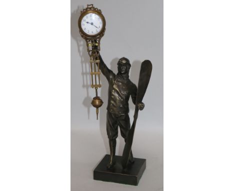 A bronzed mystery clock in the form of a pilot H.15in.