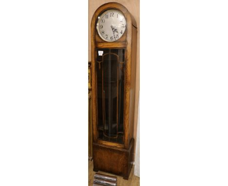 A 1930's oak cased thirty hour chiming longcase clock, H.6ft