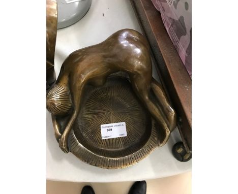 A bronze nude lady ashtray
