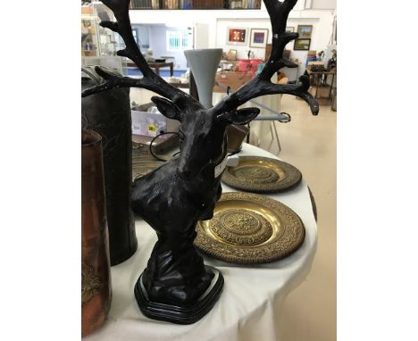A bronze stag's head on a marble base