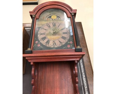 A vintage moonphase weight-driven wall clock