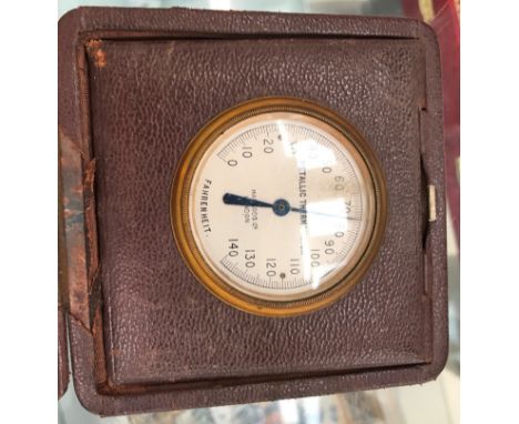 An antique Harrods cased thermometer