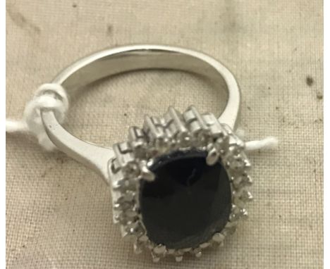 A 14k sapphire and diamond dress ring