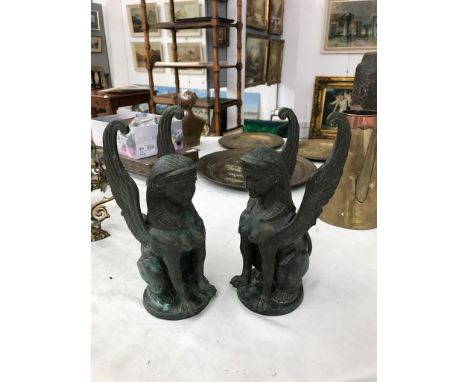Two bronze Egyptian-revival winged gryphons