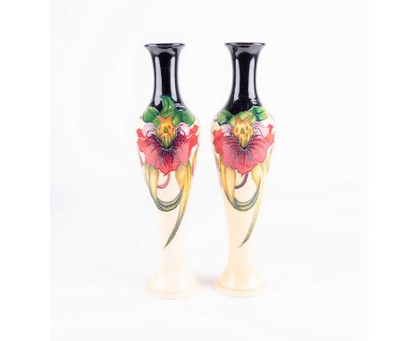 A pair of Moorcroft 'Anna Lily' pattern vases, designed by Nicola Slaney, date cypher 2010 &amp; 2011, of tall and slender fo