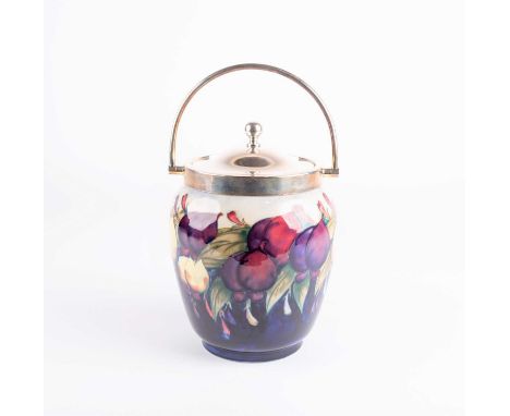 A William Moorcroft Wisteria pattern biscuit barrel, circa 1930s, with a silver plated rim and cover by William Hutton &amp; 
