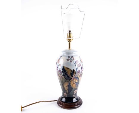 A Moorcroft 'Brambles' pattern table lamp, designed by Sally Tuffin, the well defined tube lined decoration against a shaded 