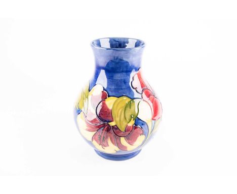 A Moorcroft Hibiscus pattern vase, third quarter of the 20th century, of bulbous form, the bold flowers with broad leaves aga