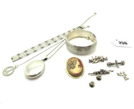A Chester Hallmarked Silver Bangle, allover engine turned; A Chester Hallmarked Silver Oval Locket Pendant, on a chain; A Che