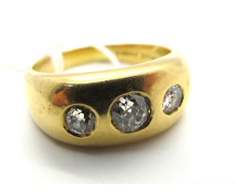 A Large 18ct Gold Gent's Graduated Three Stone Diamond Ring, the old cut stones inset within plain panel style setting.*HLBro