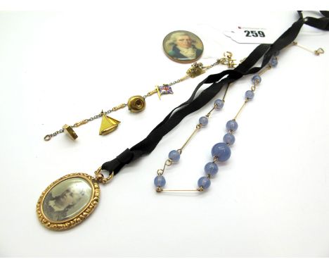 A Fancy Two Colour Bracelet, suspending novelty charm pendants, a graduated bead and wire necklace, an oval locket pendant, o