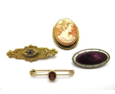 An Oval Shell Carved Cameo Brooch, depicting female profile, collet set within rope twist border, stamped ''9ct'', a Victoria