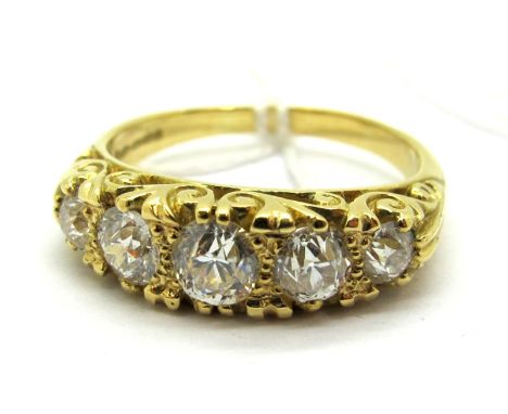 A Victorian Style Five Stone Diamond Ring, the graduated old cut stones within scroll carved setting stamped "750"