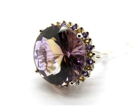 A Large Modern Ametrine (Amethyst/Citrine) Single Stone Dress Ring, four claw set within amethyst and citrine claw set border