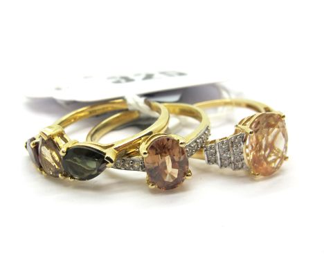 The Genuine Gemstone Company; A Modern 14ct Gold Stone Set Dress Ring, oval claw set centre, within tiered inset shoulders, *