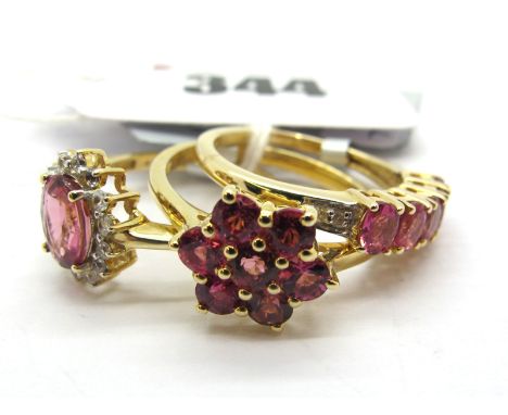 The Genuine Gemstone Company; A Modern 9ct Gold Cluster Dress Ring, of flower head design, claw set throughout, between plain