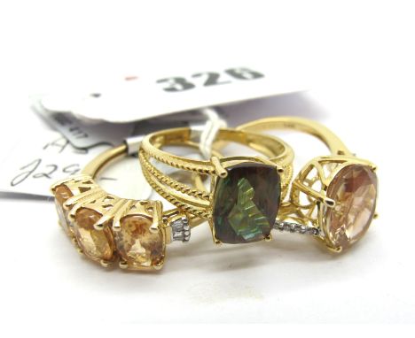 The Genuine Gemstone Company; A Modern 14ct Gold Stone Set Dress Ring, oval claw set centre, within inset slight crossover sh