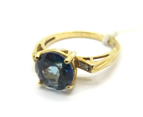 A Modern Gems TV Neptune Topaz and Diamond Set Dress Ring, circular four claw set to the centre, between inset openwork shoul