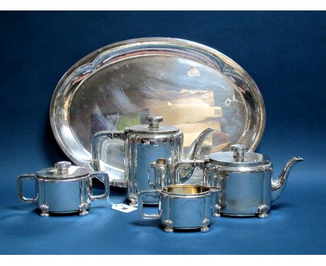 A German Four Piece Tea Set, stamped crescent and crown mark and "835", each of plain oval form with large loop handles, rais