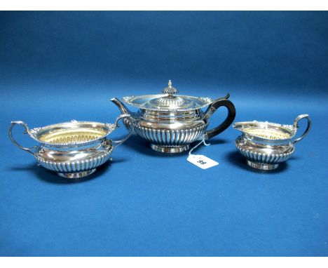 A Hallmarked Silver Bachelor's Style Three Piece Tea Set, Walker &amp; Hall, Sheffield 1893, each of compressed circular semi