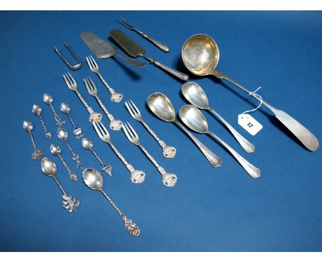 A German Fiddle Pattern Ladle, stamped crescent and crown and "800"; a set of three German spoons, pastry slices, miniature s