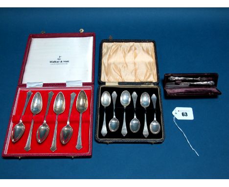 A Set of Six Hallmarked Silver Grapefruit Spoons, in a case; a set of six hallmarked silver teaspoons, in a case; and a minia