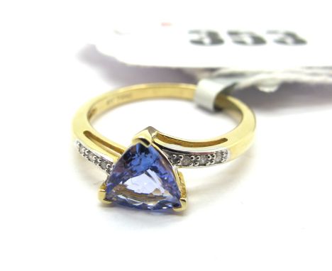 The Genuine Gemstone Company; A Modern 9ct Gold Dress Ring, with triangular centre stone, between inset crossover shoulders, 