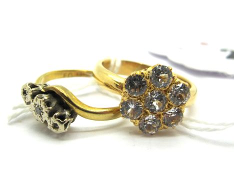 A White Sapphire Cluster Dress Ring, of flowerhead design; together with an 18ct gold three stone ring (two stones missing). 