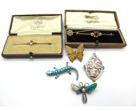 A 9ct Gold Three Stone Bar Brooch, claw set throughout, in a fitted case; a seed pearl set stickpin; a single stone set bar b