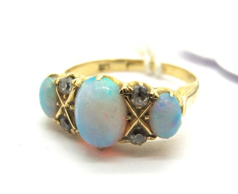 An Opal and Diamond Set Ring, claw set with three graduated oval cabochon opals, with old cut diamond set highlights, indisti