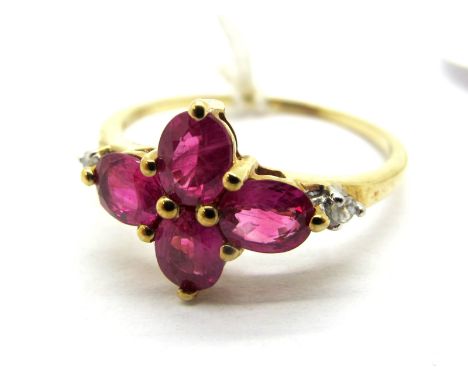 A Modern 9ct Gold Ruby Set Ring, oval claw set to the centre, between inset highlights.