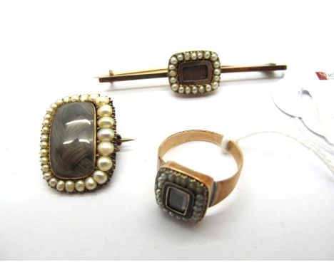 A XIX Century Pearl Set Mourning Brooch, the central rounded rectangular glazed panel encasing plaited hairwork, within gradu