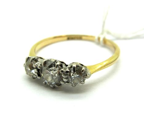 A Three Stone Diamond Ring, the graduated old cut stones claw set, stamped "18ct &amp; PT".