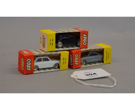 Three Lego System 1:87 scale plastic cars: #661 VW 1200 in black; #667 VW 1500 in white; #665 Karmann Ghia in grey. All boxed