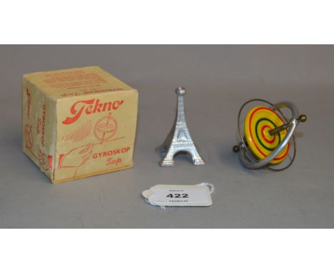 Tekno Gyroskop Top, gyroscope in yellow with red and green detail and Eiffel Tower model Boxed.